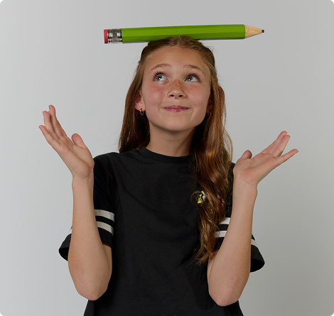 Student holding a big pencil with her head