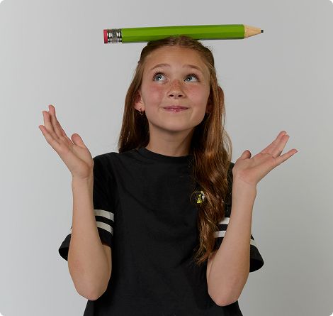 Girl with a big pencil on her head