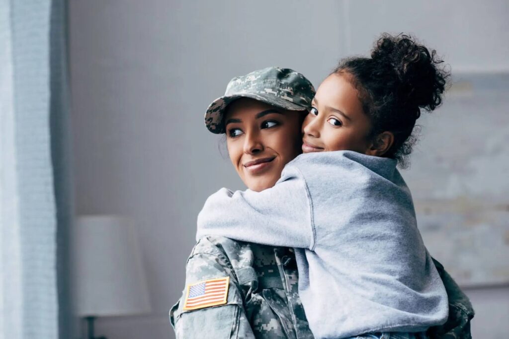 Militar woman hugging her child