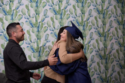 Girl hugging her mom and dad